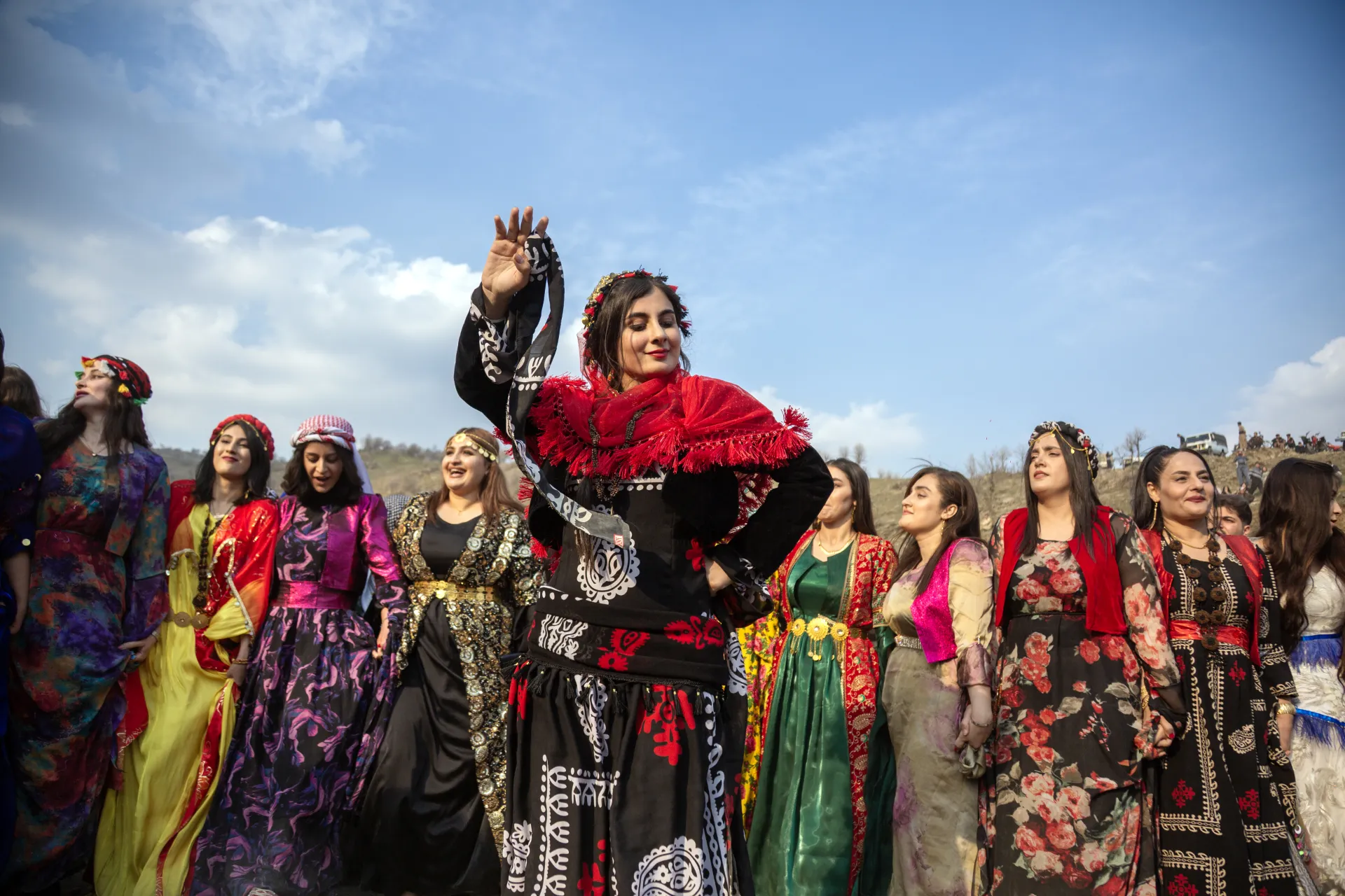 Kurdish women in traditional dress performing collective dance at Nowruz, Sisar village, Iran